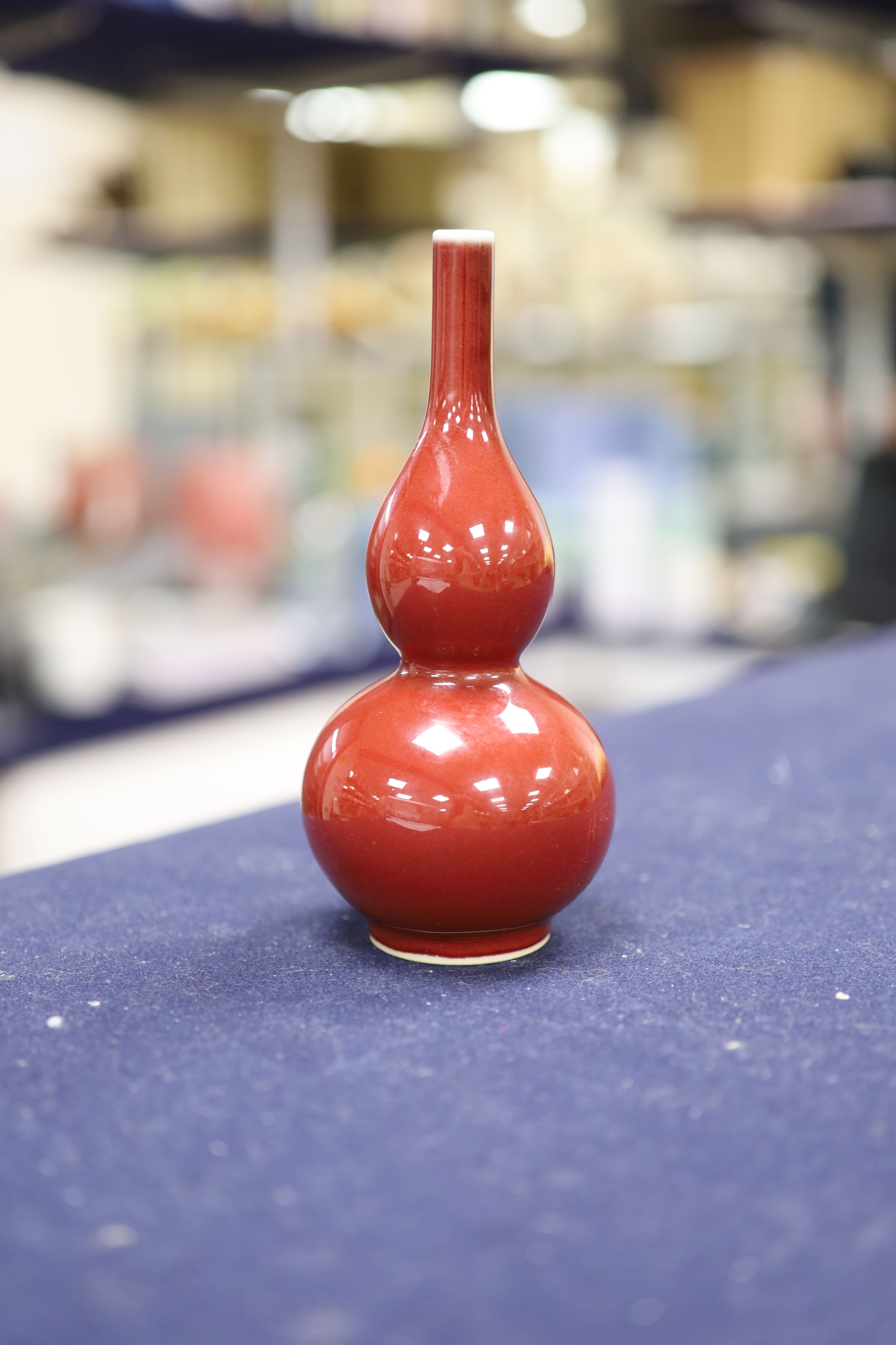 A Chinese copper red glazed double gourd vase, height 17cm